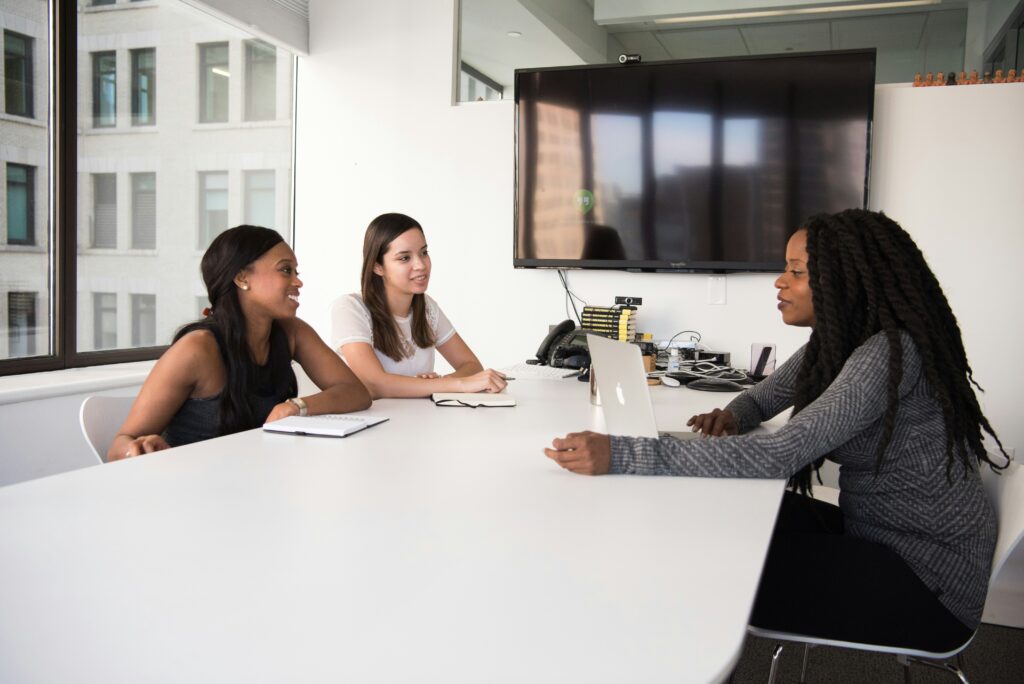 Two women interviewing another woman for a job interview