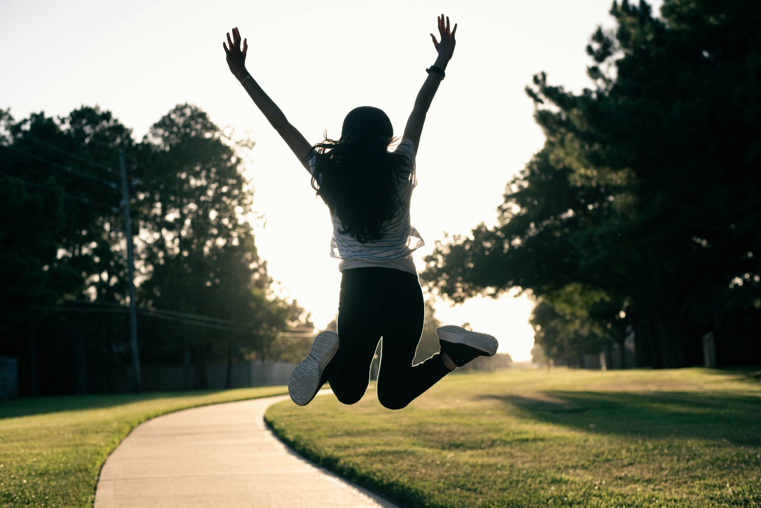 a-woman-jumping-up-doing-a-jumping-jack