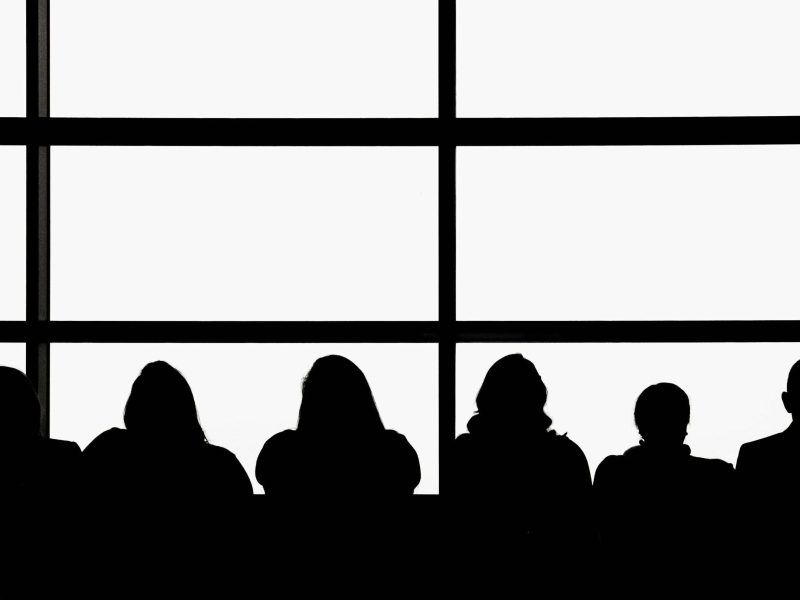 a black and white silhouette of an audience
