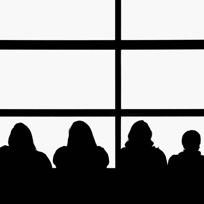 a black and white silhouette of an audience