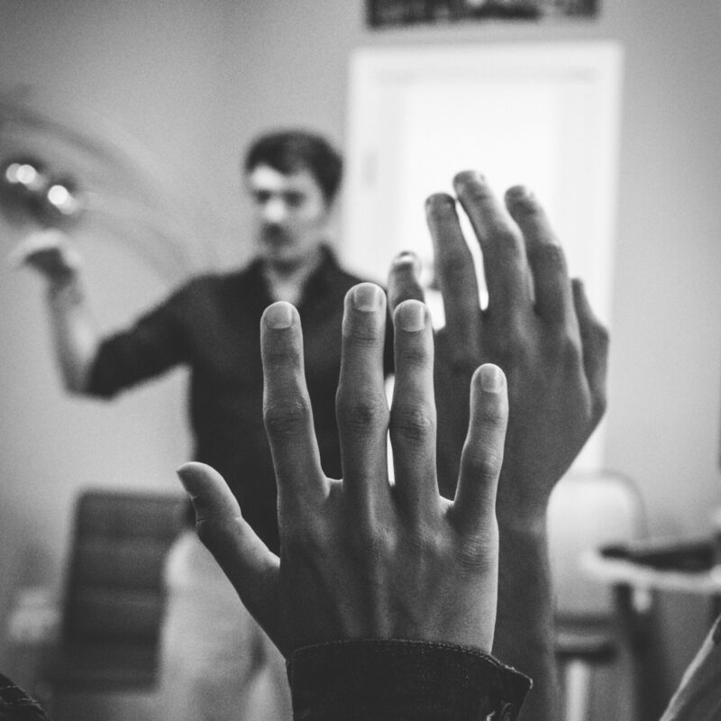 Hands raised to ask a question