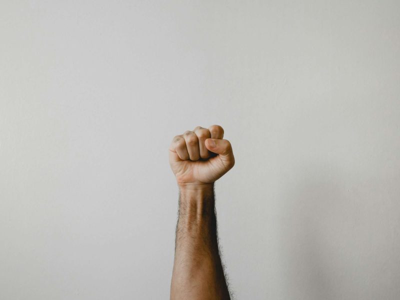 a man's fist held up high