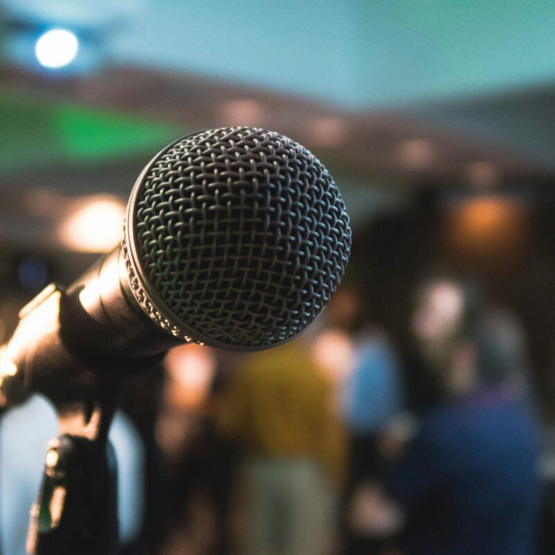 a microphone with large audience